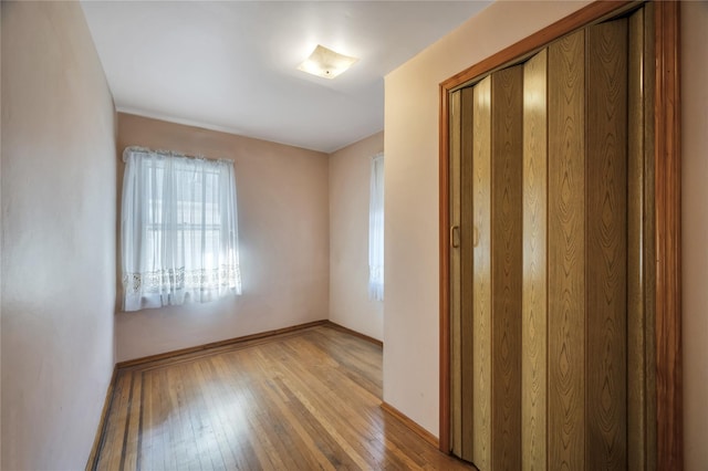 unfurnished room with light hardwood / wood-style flooring