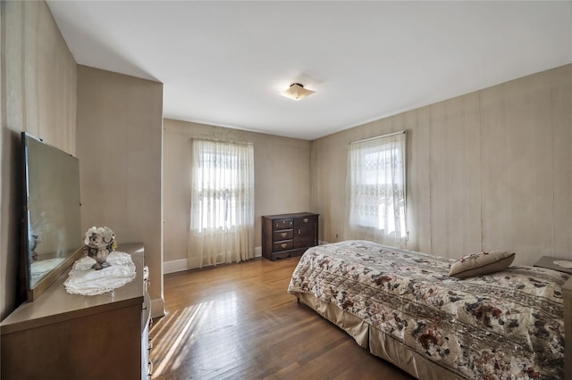 bedroom with hardwood / wood-style floors