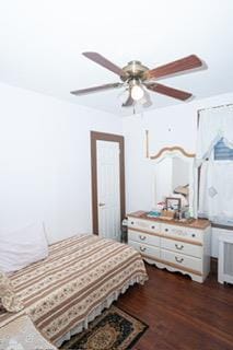 bedroom featuring ceiling fan and dark wood-type flooring