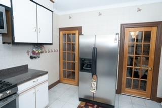 kitchen with white cabinetry, stainless steel appliances, and french doors