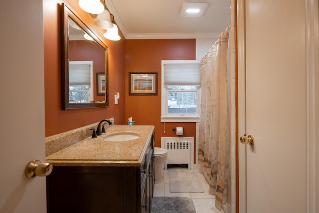 bathroom featuring radiator heating unit, tile patterned floors, vanity, toilet, and crown molding