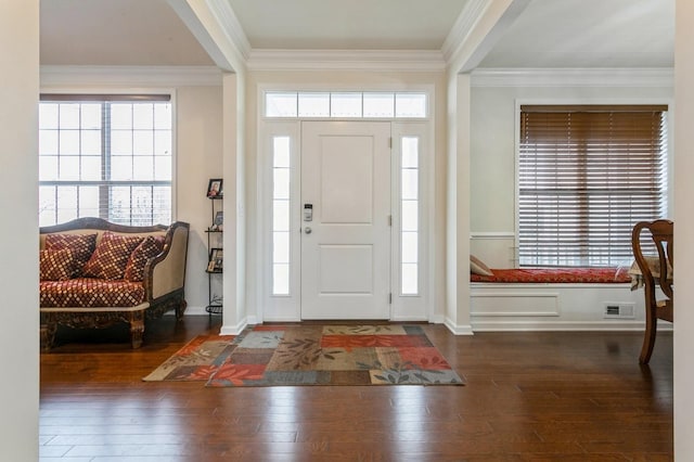 entryway featuring dark wood-type flooring and crown molding