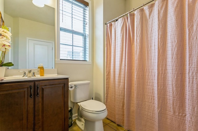 bathroom featuring toilet, tile patterned floors, a shower with shower curtain, and vanity