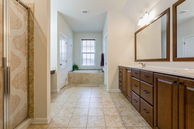 bathroom featuring vanity, tile patterned floors, and separate shower and tub