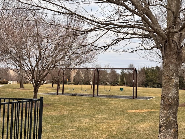 view of property's community with a lawn