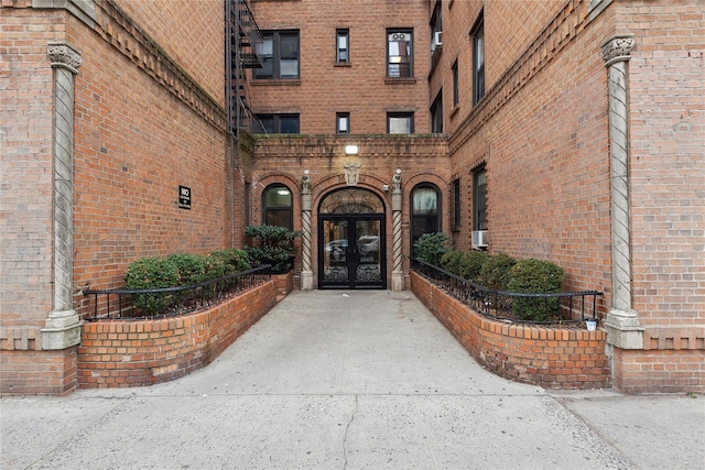 view of exterior entry featuring french doors