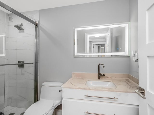 bathroom with vanity, toilet, and walk in shower