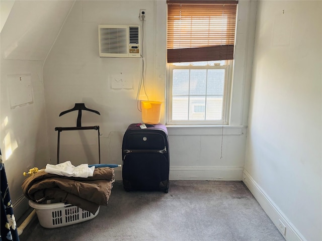 living area with vaulted ceiling, light colored carpet, a wealth of natural light, and a wall mounted AC