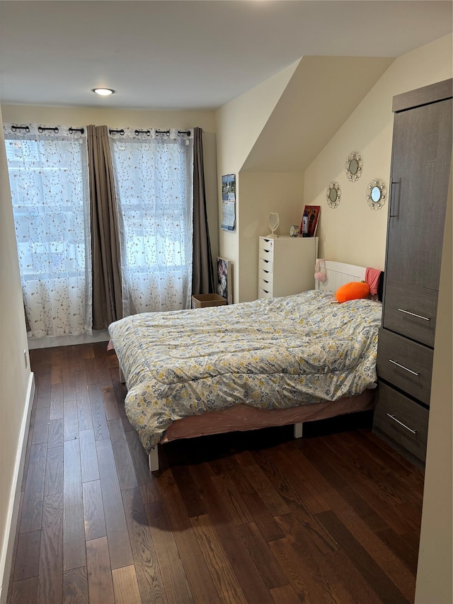 bedroom featuring dark hardwood / wood-style flooring