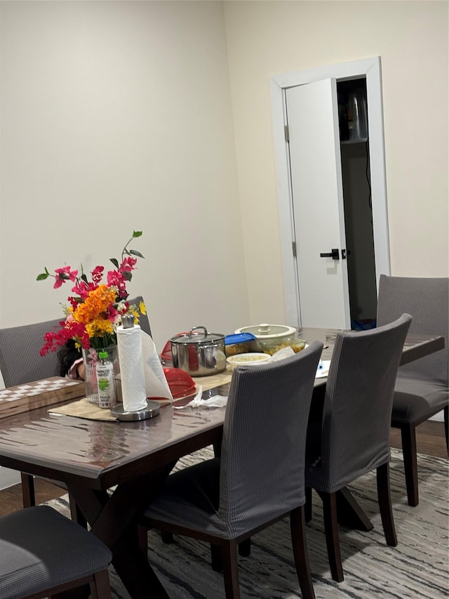 dining space featuring wood-type flooring