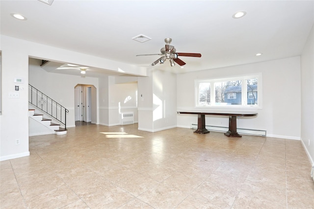 unfurnished living room featuring ceiling fan