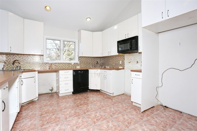 kitchen featuring sink, white cabinets, black appliances, and light tile patterned floors