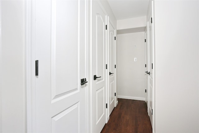 hallway featuring dark hardwood / wood-style floors