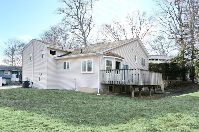 back of house featuring a lawn, central AC unit, and a deck