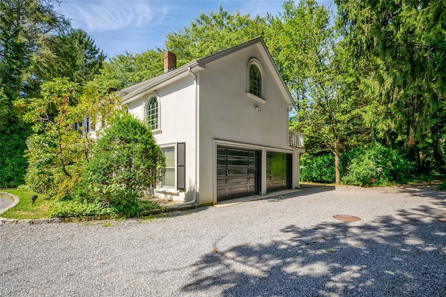 view of property exterior featuring a garage