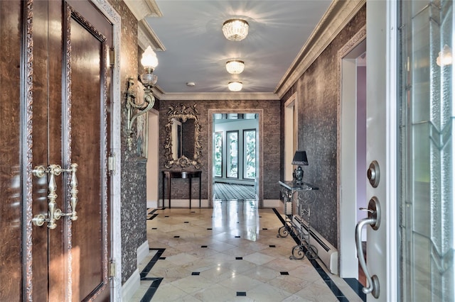 foyer entrance with crown molding and a baseboard heating unit