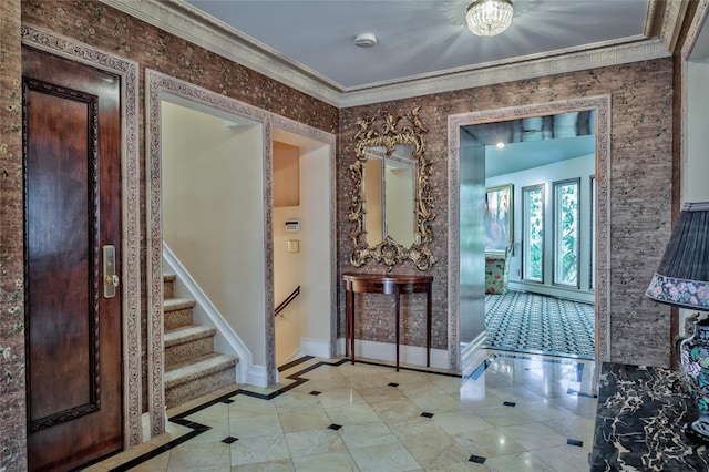 tiled foyer with crown molding