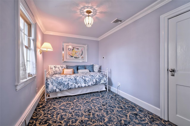 carpeted bedroom with ornamental molding and a baseboard heating unit