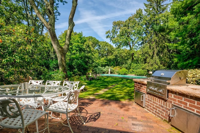 view of patio with grilling area and exterior kitchen