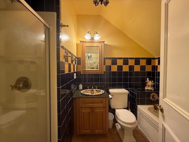 full bathroom featuring plus walk in shower, lofted ceiling, tile walls, vanity, and toilet