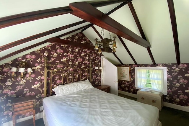 bedroom with lofted ceiling with beams