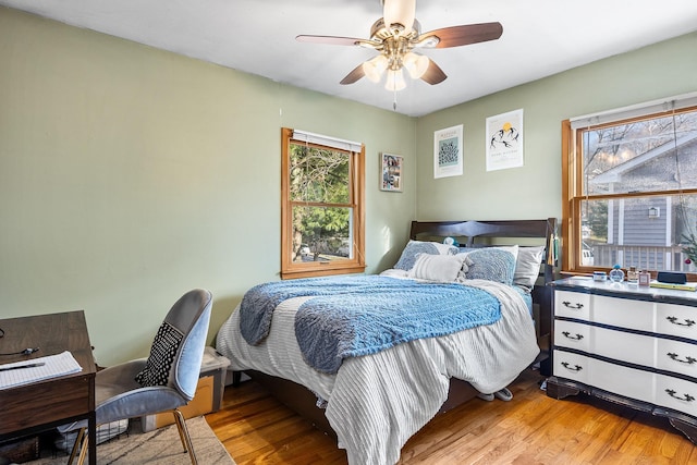 bedroom with light wood-type flooring and ceiling fan