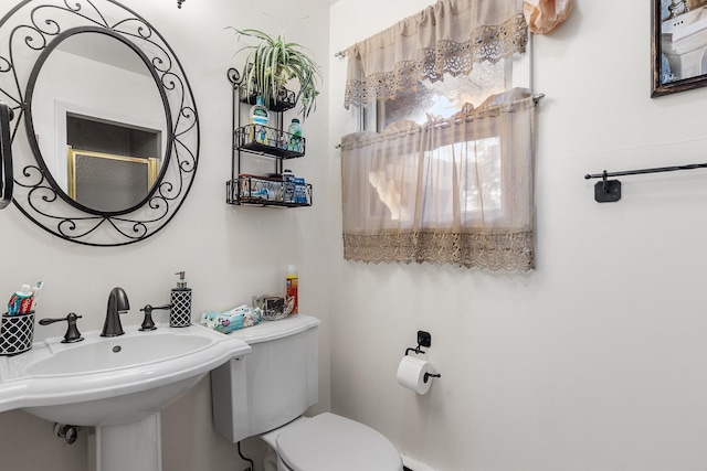 bathroom with sink and toilet