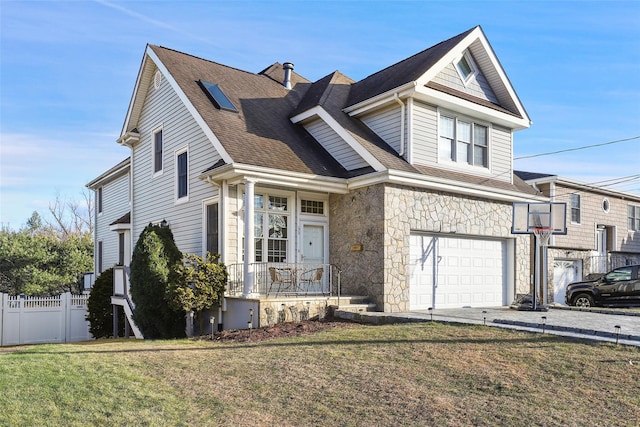 view of front of house featuring a front yard and a garage