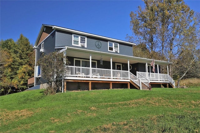 view of front of house featuring covered porch and a front yard