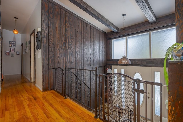 75 Tennyson Dr, Nanuet, NY 10954 - hallway with light hardwood / wood-style flooring, wooden walls, and beamed ceiling
