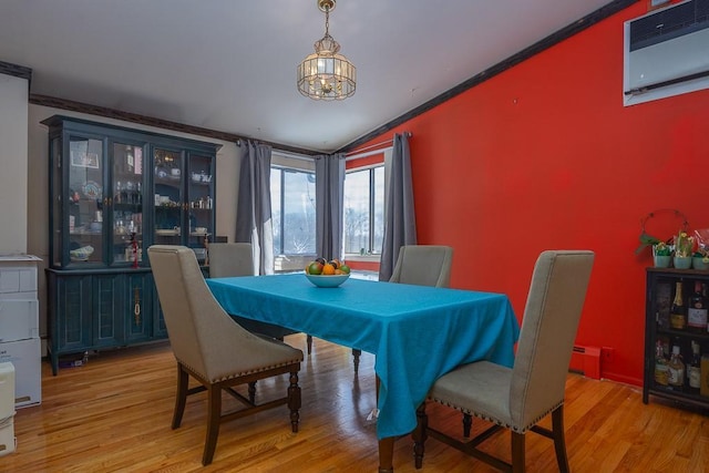 75 Tennyson Dr, Nanuet, NY 10954 - dining area with ornamental molding, light hardwood / wood-style floors, and a wall unit AC