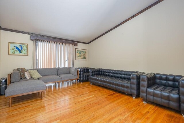 75 Tennyson Dr, Nanuet, NY 10954 - living room with vaulted ceiling, ornamental molding, and hardwood / wood-style floors