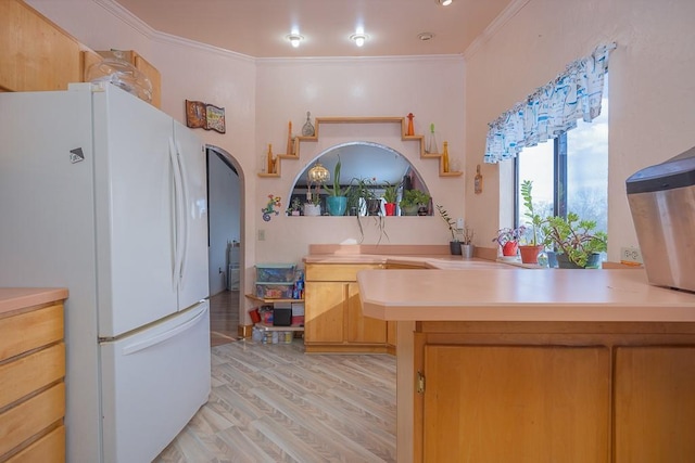 75 Tennyson Dr, Nanuet, NY 10954 - kitchen featuring ornamental molding, white fridge, and light wood-type flooring