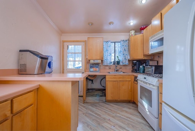 75 Tennyson Dr, Nanuet, NY 10954 - kitchen featuring kitchen peninsula, sink, white appliances, light hardwood / wood-style flooring, and ornamental molding