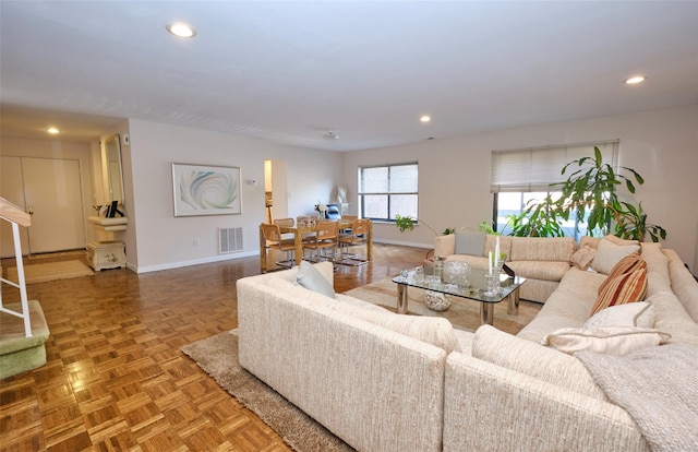 living room featuring parquet floors