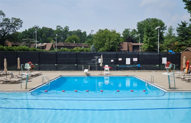 view of swimming pool featuring a patio