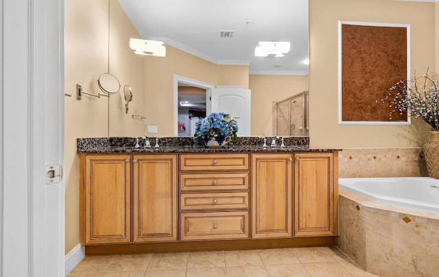 bathroom with tile patterned floors, vanity, ornamental molding, and shower with separate bathtub