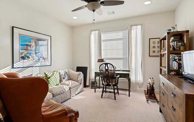 interior space featuring ceiling fan and light colored carpet