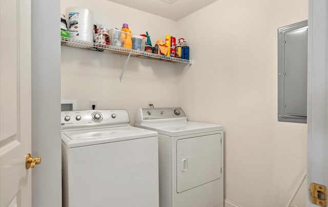 laundry area with separate washer and dryer and electric panel