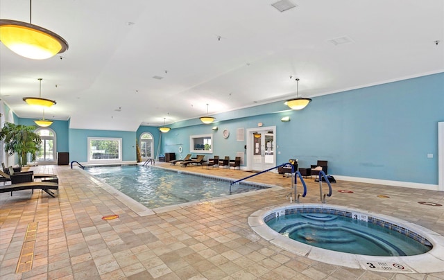 view of swimming pool featuring an indoor hot tub and french doors