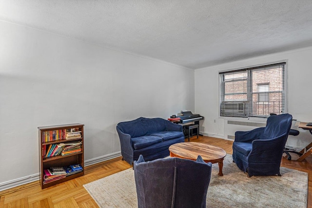 living area with a textured ceiling, radiator, and light parquet floors