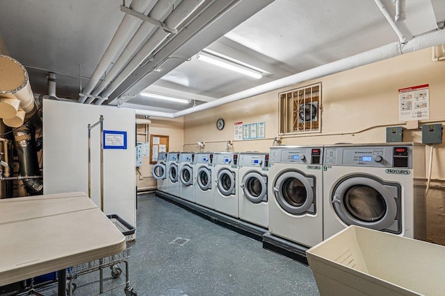 laundry area with independent washer and dryer