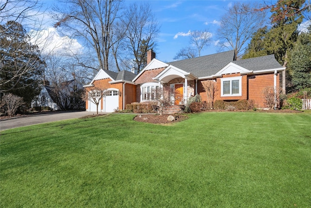 view of front of house with a front lawn and a garage