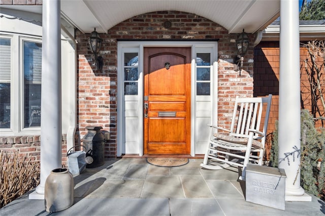 property entrance with covered porch