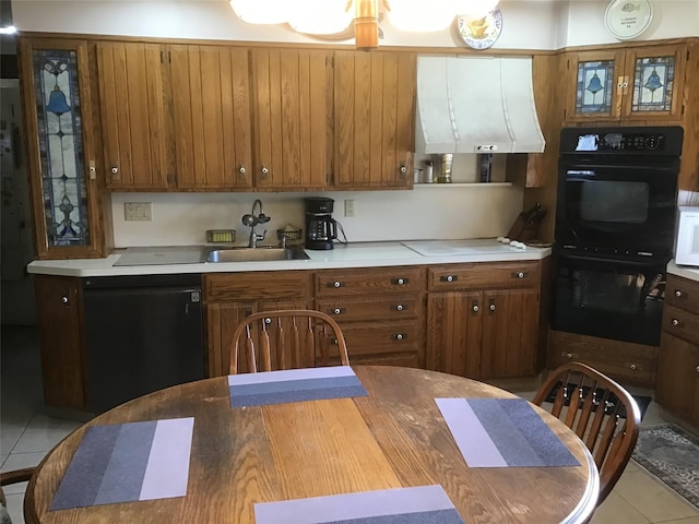 kitchen with black appliances, ventilation hood, light tile patterned floors, and sink