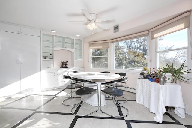 dining space with ceiling fan and light tile patterned flooring