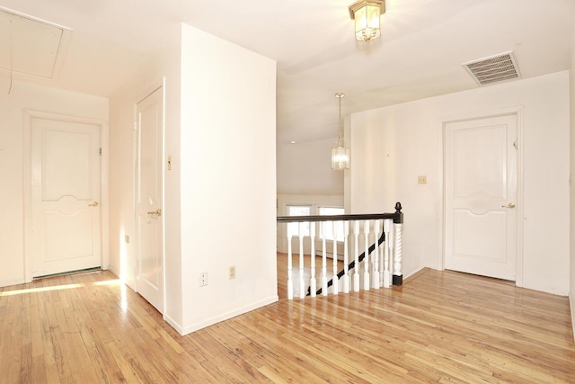 hallway with light wood-type flooring