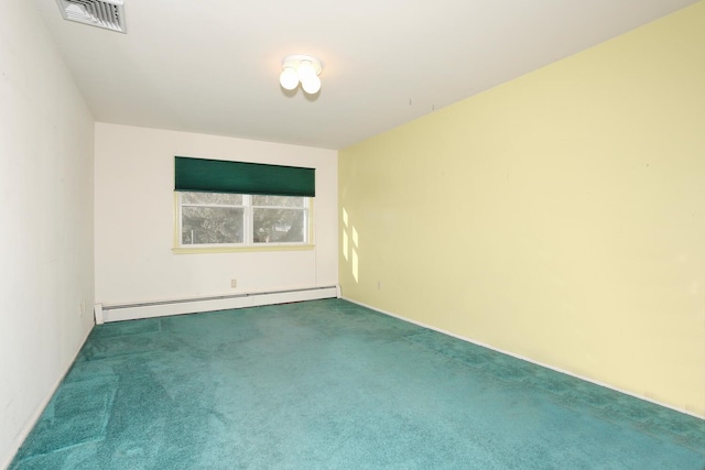 carpeted spare room featuring baseboard heating