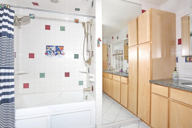 bathroom featuring tile patterned floors, shower / bath combination with curtain, and vanity