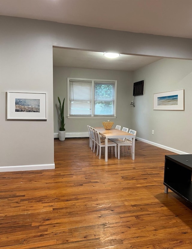 dining area featuring wood-type flooring